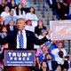 Donald Trump holds up a sign at a rally in Sunrise, Florida on August 10, 2016 (Photo by Johnny Louis/WireImage)